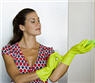 Woman adjusting her cleaning gloves.