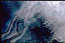 Ocean surface with streaks through heavily oiled surface
