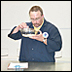 A NOAA seafood tester examines seafood as part of a sensory test.