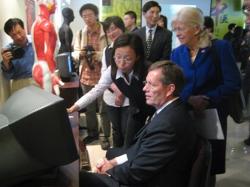 May 13, 2008 – U.S. Secretary of Health and Human Services (HHS) Michael O. Leavitt (right) and Josephine Briggs, M.D., the Director of the National Center for Complementary and Alternative Medicine of the HHS National Institutes of Health (left), receive a lesson in acupunture techniques from a student at the Shanghai University of Traditional Chinese Medicine, in Shanghai, China. (Photo Credit: Bill Steiger, HHS)
