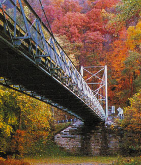 The Corbin Bridge in PA was the first to have an aluminum deck replacement (in 1996).