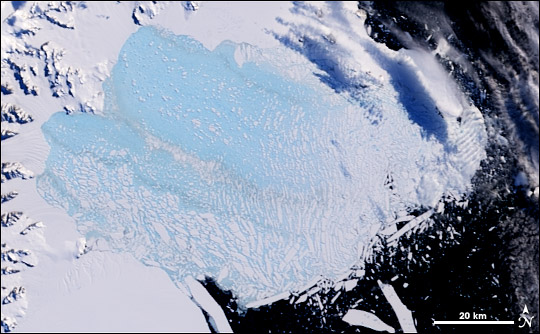 Satellite image of the collapse of the Larsen-B ice shelf, Antarctica.