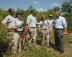 Small photo: President Bush talking with volunteers at Rookery Bay