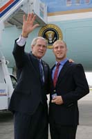 President George W. Bush presented the President's Volunteer Service Award to Josh Kelchner upon arrival in Fort Myers, Florida, on Friday, June 20, 2008.  Kelchner, 18, is a volunteer with Voices for Kids of Southwest Florida, the Children's Home Society of Florida, and McGregor Baptist Church.  To thank them for making a difference in the lives of others, President Bush honors a local volunteer when he travels throughout the United States.  He has met with more than 600 volunteers, like Kelchner, since March 2002.