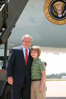 President George W. Bush presented the President's Volunteer Service Award to Robbie Powell, 12, upon arrival in Little Rock, Arkansas, on Tuesday, July 1, 2008.  Robbie organized the Live 4 Ben fundraising campaign and is a volunteer with the Conway Braves.  To thank them for making a difference in the lives of others, President Bush honors a local volunteer when he travels throughout the United States.  He has met with more than 600 volunteers, like Robbie, since March 2002.