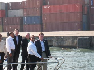 January 9, 2008 – HHS Secretary Michael O. Leavitt (right) tours the Port of Cochin in Kerala State with Indian port officials. He is joined by the Commissioner of the HHS Food and Drug Administration, the Honorable Andrew von Eschenbach, M.D. (third from right), and U.S. Consul General David Hopper (fourth from right).