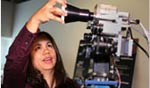 photo of maria bualat adjusting robot