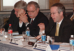 As former Critical Infrastructure Protection Board Vice Chair Howard Schmidt (center) and Robert Stephan (left), Homeland Security Special Assistant for Information Analysis and Infrastructure Protection, listen, Paul Kurtz, Senior Director for Critical Infrastructure Protection with the White House Homeland Security Council, addresses members the President’s National Security Telecommunications Advisory Committee (NSTAC)