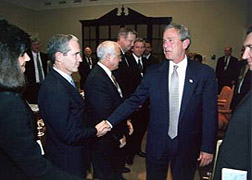 Motorola Chairman and Chief Executive Officer Christopher Galvin is greeted by President George W. Bush 