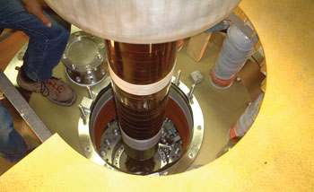 Photo of the insert coil being loaded into the magnet.