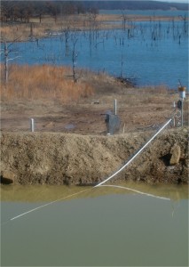 USGS scientist collecting water-quality samples during a hydrogen-consuming, push-pull injection test at the Norman Municipal Landfill Research Site, Okla. The test is used to determine what microbiological processes are active in the subsurface at ground-water contamination sites. 