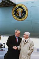 President George W. Bush met Lawrence Jeffery upon arrival in Manchester, New Hampshire, on Thursday, March 25, 2004.  For more than 15 years, Jeffery has been an active volunteer with SCORE Counselors to America's Small Business, a resource partner of the U.S. Small Business Administration.