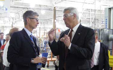  U.S. Commerce Assistant Secretary William G. Sutton (right) leads the second Sustainable Manufacturing American Regional Tour (SMART) at Steelcase, Inc., a Michigan-based wood products manufacturer.