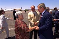 President George W. Bush met Ophelia Chaffino upon arrival in Las Cruces, New Mexico tomorrow, Saturday, August 24, 2002. Chaffino tutors 4th and 5th grade students as a volunteer with the Foster Grandparents program. 