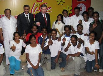 January 7, 2008 – In Chennai, the capital of the Indian State of Tamil Nadu, members of the Loyola College chapter of the Red Ribbon Club pose with U.S. Secretary of Health and Human Services Michael O. Leavitt and the Indian Union Minister for Health and Family Welfare, the Honorable Anbumani Ramadoss, M.D., M.P.