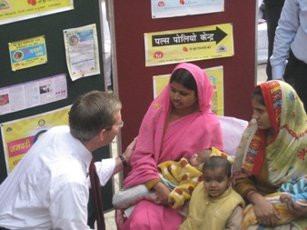 January 11, 2008 – U.S. Secretary of Health and Human Services Michael O. Leavitt greets a young mother during a National Immunization Days event at the Sriniwaspuri Maternal and Child Welfare Center in New Delhi, India, where he administered vaccine to children to show support for India's efforts to eradicate polio.