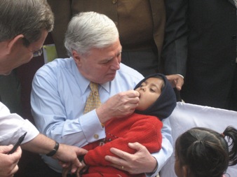 January 11, 2008 – The Honorable Andrew von Eschenbach, M.D., Commissioner of the Food and Drug Administration within the U.S. Department of Health and Human Services administers oral polio vaccine to a small child at the Sriniwaspuri Maternal and Child Welfare Center in New Delhi, India, to show support for India's efforts to eradicate polio.