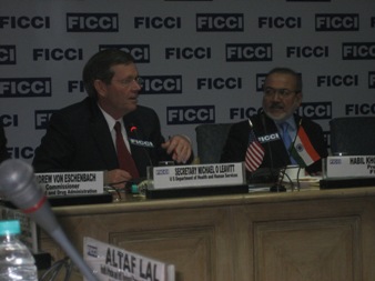 January 11, 2008 – U.S. Secretary of Health and Human Services Michael O. Leavitt (left) speaks on product safety at a meeting of the Federation of Indian Chambers of Commerce and Industry (FICCI), in New Delhi, India. Next to the Secretary is the President of FICCI, Habil Khorakiwala.