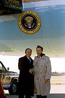 President George W. Bush met Bradley Simmons upon arrival in Detroit, Michigan, on Monday, December 1, 2003. Simmons has been an active volunteer with Boy Scouts of America and Brother Rice High School for over 20 years.