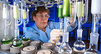 Photograph of a Chemist extracting chemicals.