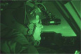 Lt. Col. Robert Weichert, a C-17 evaluator pilot with the 313th Airlift Squadron at McChord Air Force Base, Wash., looks out over the ice after the first-ever night vision goggle-assisted landing on Pegasus Ice Runway near McMurdo Station, Antarctica.