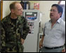 photo thumbnail: LCDR Andrew Sallach, a civil engineer, meets with the Minister of Infrastructure, Water, and Sanitation Services at the central water treatment plant for the City of Dili. 
