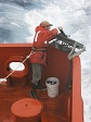 Photo of Skip Owen replacing an XBT probe on the LAURENCE M. GOULD research vessel.