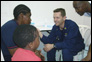 Photo thumbnail: LCDR Joseph Simon speaks to patients in Colombia.