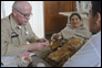 Photo thumbnail: CDR Kevin Prohaska treats a patient in Peru.