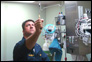 Photo thumbnail: LT Jason Mangum uses a smoke tube to determine airflow direction in an isolation room.