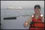 Photo thumbnail: LT Jason Mangum commuting to work from the USNS Comfort aboard the hospitality boat.