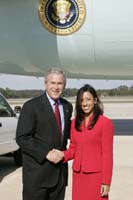 President George W. Bush presented the President’s Volunteer Service Award to United States Air Force Second Lieutenant Melissa Rosa upon arrival at the airport in Macon, Georgia, on Tuesday, October 10, 2006.  Rosa, 24, is a volunteer with Hands On Macon. To thank them for making a difference in the lives of others, President Bush honors a local volunteer, called a USA Freedom Corps Greeter, when he travels throughout the United States.  President Bush has met with more than 500 individuals around the country, like Rosa, since March 2002.