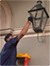 photo of man lighting lantern in French Quarter