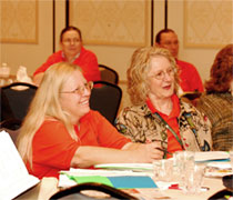 Panel participants listen to a presentation