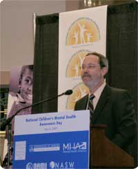 SAMHSA's Gary Blau, Ph.D., standing at podium at National Children's Mental Health Awareness Day