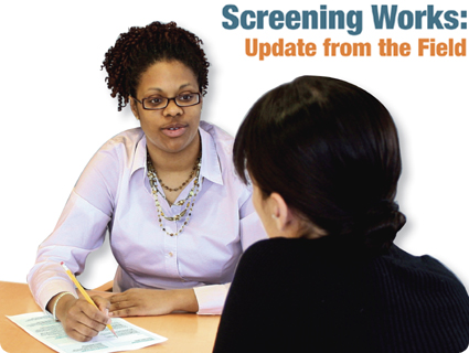 photo of a health educator at a desk writing down information from a female patient seated across from her - Screening Works: Update from the Field