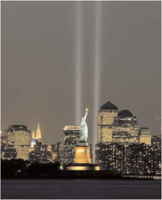 Photo of “Tribute in Light,” two sets of vertical searchlight beams emanating from the New York skyline in remembrance of the World Trade Center attacks.