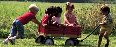 Photo: Children playing with wagon