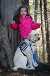 Photo: Girl with assistance dog