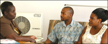 Photo: A couple receiving counseling from a healthcare professional 