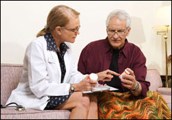 Photo: A man consulting a healthcare professional.