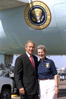 President George W. Bush met Winifred "Freddie" McBride upon arrival in Portland, Oregon on Thursday, August 22, 2002. McBride serves as a "Volunteer In Police Service" with the Beaverton Police Department. 