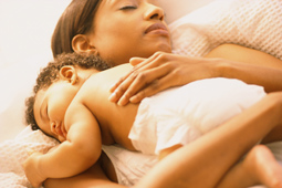 woman sleeping with baby