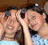 Image of students participating in various theme-based activities during a 2-hour workshop at the New Mexico Museum of Natural History and Science