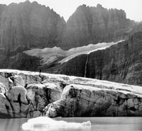 Person standing on Grinnell Glacier, 1938, Hileman photo, courtesy of GNP Archives