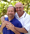 Image of two older men embracing.