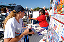 Becky Mizener (far right) of Packed with Pride, a supporter of America Supports You, hands out pamphlets to participants of the 4th Annual National America Supports You Freedom Walk Sept. 7, 2008, at the Pentagon after completing the walk. Nearly 10,000 people are estimated to have taken part in the walk to reflect on the lives lost on Sept. 11, 2001. Defense Dept. photo by Army Staff Sgt. Michael Carden