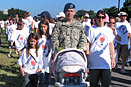 Army Staff Sgt. Chad Atkinson walked with his family in the fourth annual America Supports You Freedom Walk. Joining him are his wife, Sylvia, right; daughter Mackenzie, 9, far left; daughter Rylia, 11, left; and 16-day-old daughter, Sophie. Defense Dept. photo by Donna Miles
