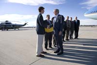 President George W. Bush presented the President’s Volunteer Service Award to Matt Cook, 17, upon arrival at the airport in Los Angeles, California, on Tuesday, October 3, 2006.  Cook is the founder of the Mile-Long Yellow Ribbon Project.  To thank them for making a difference in the lives of others, President Bush honors a local volunteer, called a USA Freedom Corps Greeter, when he travels throughout the United States.  President Bush has met with more than 500 individuals around the country, like Cook, since March 2002.