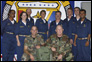 photo thumbnail: Back row from left to right: LT Tracy Branch, LCDR Aimee Treffiletti, CDR Steven Bosiljevac, CAPT Kathleen Downs, CDR Dale Bates, LCDR Stephen Piontkowski, CAPT Michael Wilcox, LT Nazmul Hassan. Front row left to right: LCDR Edward Dieser, bag represents CDR John Moroney who was ashore in Josephstaal, LCDR George Hanley.